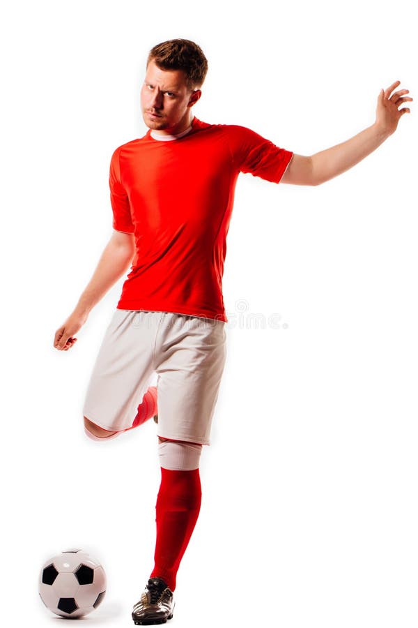 Junger Fußballspieler mit Ball auf schwarzem Hintergrund im Studio lizenzfreie stockfotografie Junger Fußballspieler mit Ball auf schwarzem Hintergrund im Studio lizenzfreie stockfotografie