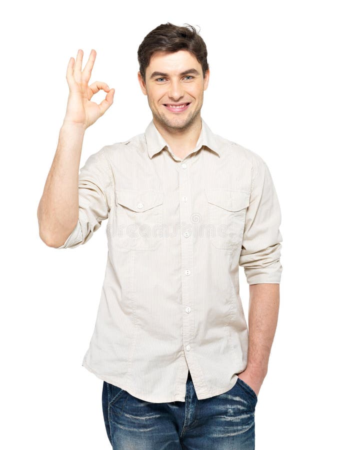 Junger glücklicher Mann mit okayzeichen stockbild Junger glücklicher Mann mit okayzeichen stockbild