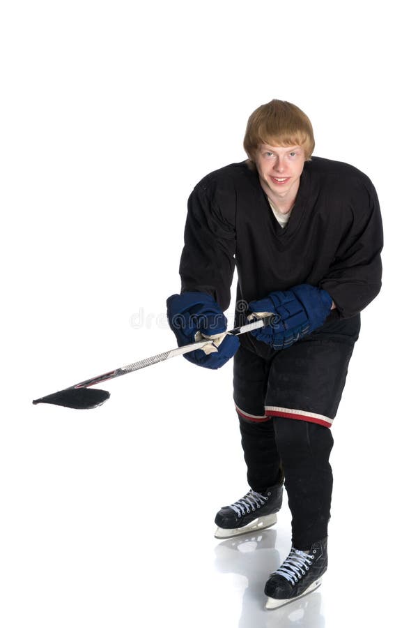 Junger Kerlhockeyspieler stockbild