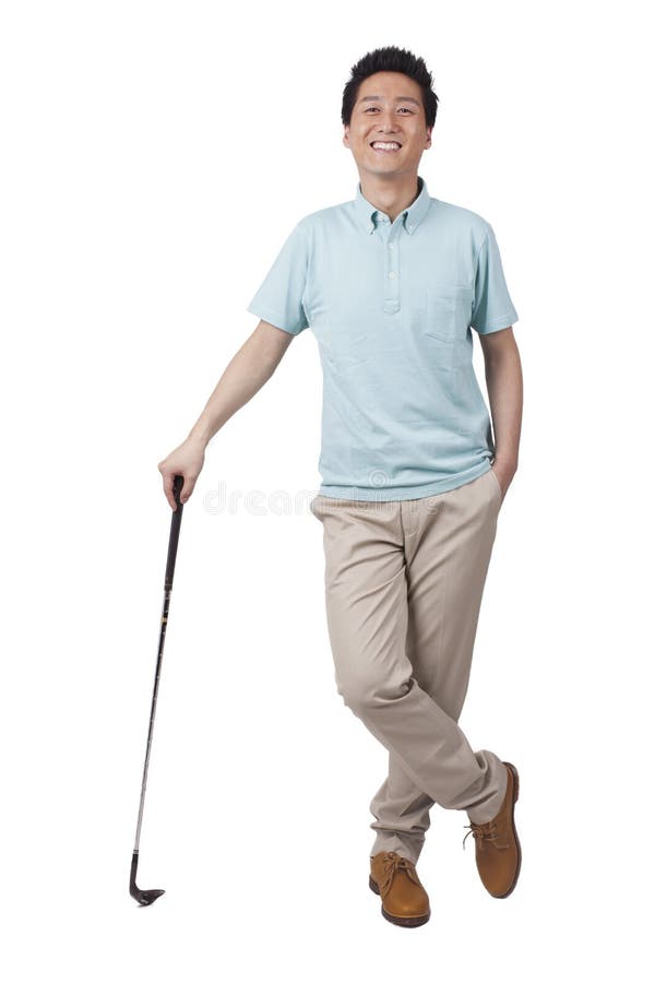 Junger Mann, der Golf genießt stockbilder