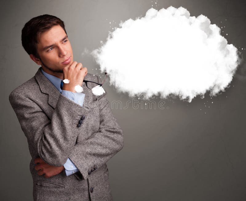 Junger Mann, der an Wolkenrede oder Gedankenblase mit Spindel denkt stockfotografie Junger Mann, der an Wolkenrede oder Gedankenblase mit Spindel denkt stockfotografie