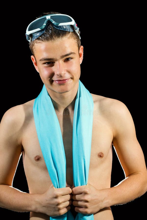 Junger Schwimmer gegen schwarzen Hintergrund lizenzfreies stockfoto Junger Schwimmer gegen schwarzen Hintergrund lizenzfreies stockfoto