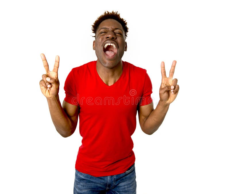 Young friendly and happy afro american man smiling excited and posing cool and cheerful isolated on white background having fun looking positive in intense happiness facial expression. Young friendly and happy afro american man smiling excited and posing cool and cheerful isolated on white background having fun looking positive in intense happiness facial expression