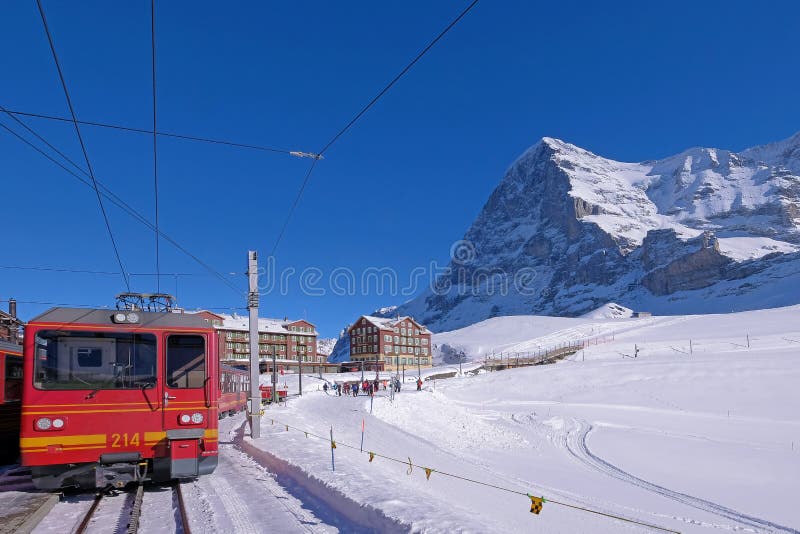 Jungfrau railway train station at Kleine Scheidegg to Jungfraujoch, north face of mount Eiger in background, Switzerland