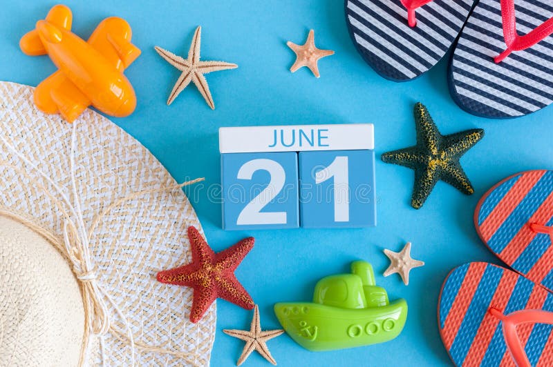 June 21st. Image of june 21 calendar on blue background with summer beach, traveler outfit and accessories. Summer day. June 21st. Image of june 21 calendar on blue background with summer beach, traveler outfit and accessories. Summer day.