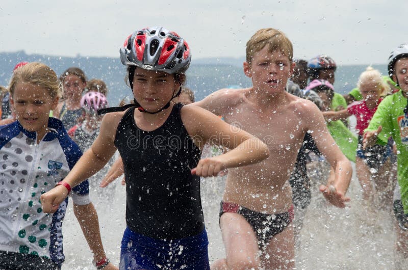 Junior triathlon runners at aQuelle Mudman Series royalty free stock photo Junior triathlon runners at aQuelle Mudman Series royalty free stock photo