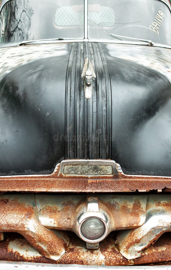 Junkyard Car with Rusty Bumper and Black Hood with Hood Ornament Editorial Photography Image