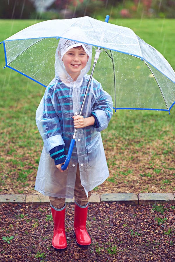 Just a Boy in the Rain. Full Length Portrait of a Young Boy Standing ...