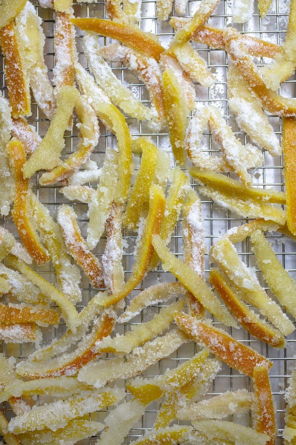 Candied orange and lemon peels resting in a pan to dry until done. Candied orange and lemon peels resting in a pan to dry until done