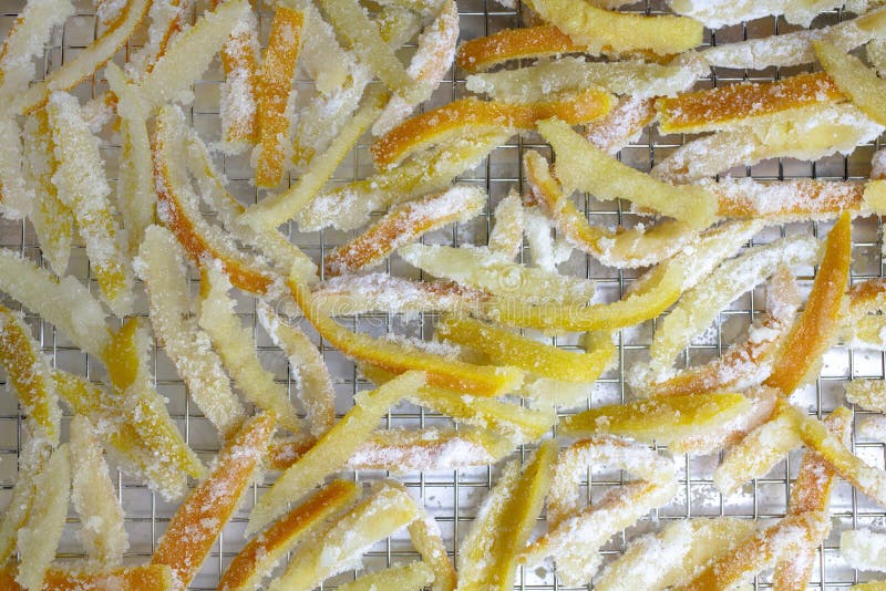 Candied orange and lemon peels resting in a pan to dry until done. Candied orange and lemon peels resting in a pan to dry until done