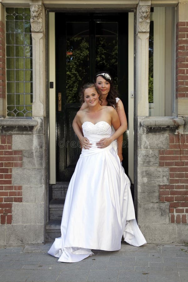 Just Married Lesbian Pair On Doorstep Of Old City Hall Stock Image