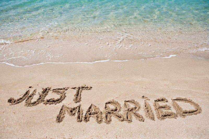 Just married written on the sand. Just married written on the sand