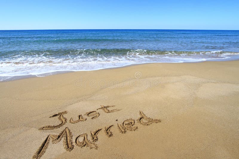 Just married written on golden sandy beach. Just married written on golden sandy beach