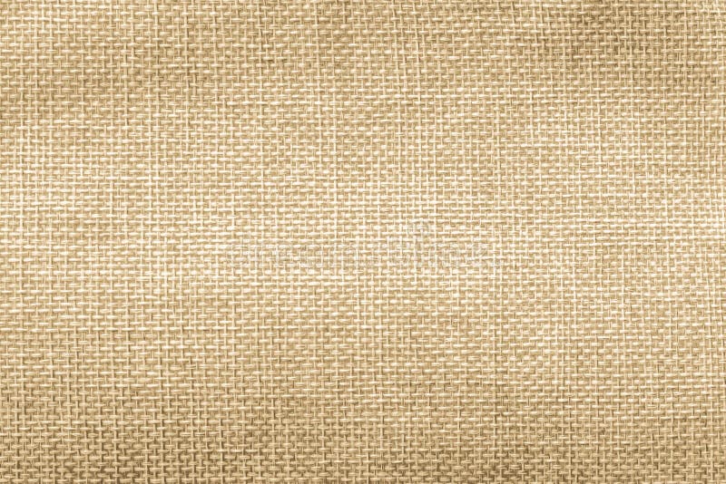 Jute hessian sackcloth natural burlap texture background in yellow gold brown color stock images