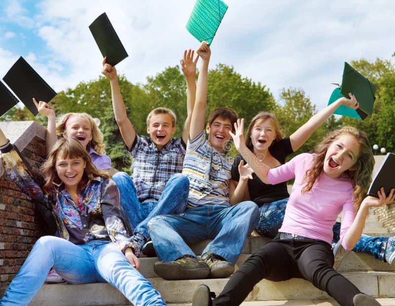 Excited youth sitting on stairway. Excited youth sitting on stairway