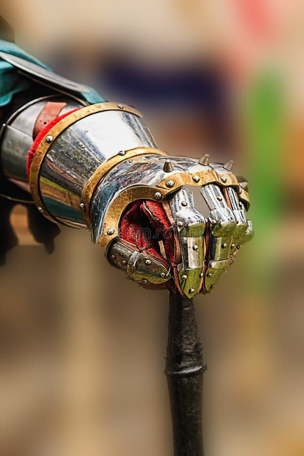 A knights gauntlet holds the end of the sword that he is sworn to protect against all who challenge. A knights gauntlet holds the end of the sword that he is sworn to protect against all who challenge.