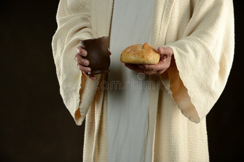 Jésus retenant le pain et une cuvette de vin