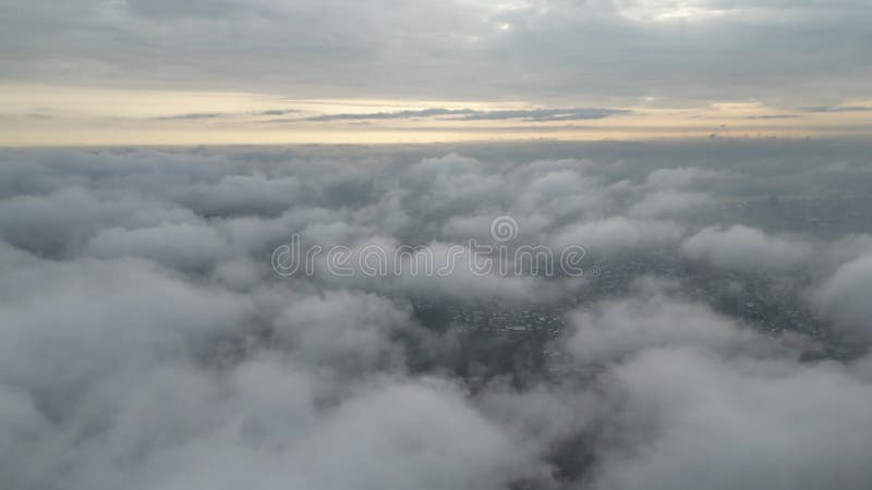 4K Aerial view front of airplane flying through the white fluffy clouds stock video