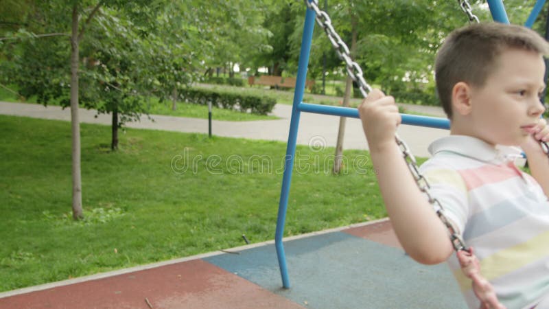 4k Mom Rides Her Son On A Swing In The Park In The Summer Stock Footage Video Of Cheerful