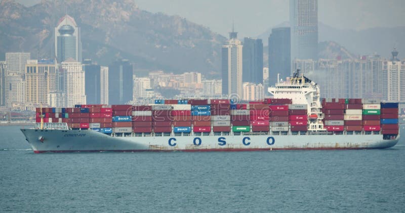 4k Cargo Container Ships Through The QingDao Harbo,moder urban building,china.