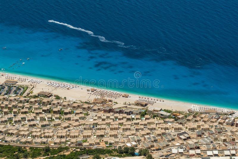 Seascape of the Ionian sea coast in Dhermi, Albania. Aerial view of the modern summer houses in Albanian luxury resort town. Seascape of the Ionian sea coast in Dhermi, Albania. Aerial view of the modern summer houses in Albanian luxury resort town