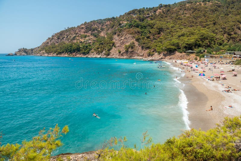 Kabak beach on the Mediterranean coast in Mugla province of Turkey. View with people in summer