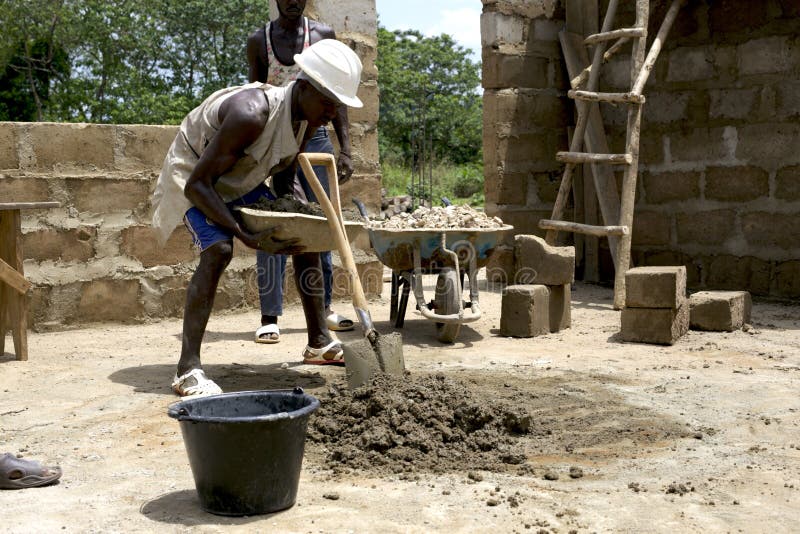 Kabala, Sierra Leone - May 29th 2019: young african working in construction in africa. Construction and industry context