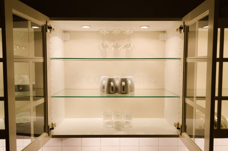 Cabinet filled with glasses in kitchen. Cabinet filled with glasses in kitchen