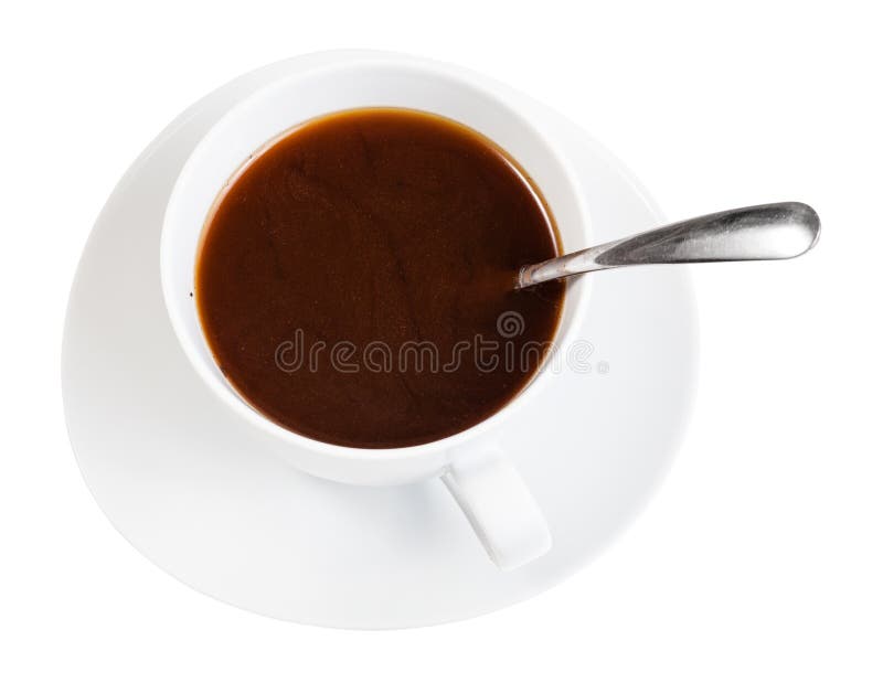 Kaffedrink i den vita koppen med skeden på tefatet arkivfoton Kaffedrink i den vita koppen med skeden på tefatet arkivfoton