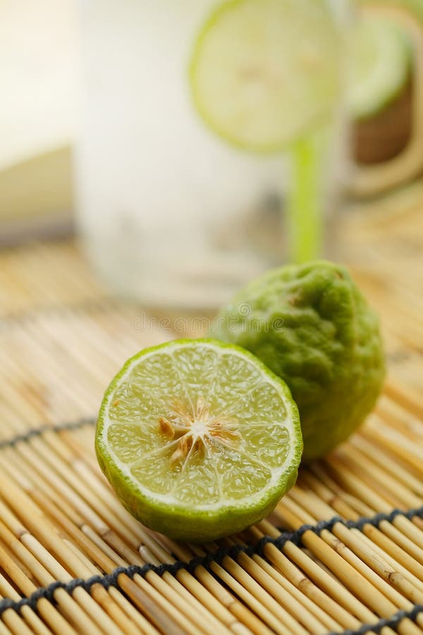 Kaffir lime So, Bergamot soda Cool drink, Thailand tradition Herb for Treatment of Acid Reflux, with Oriental Earth tone map backg. Round.Have some space for royalty free stock photography Kaffir lime So, Bergamot soda Cool drink, Thailand tradition Herb for Treatment of Acid Reflux, with Oriental Earth tone map backg. Round.Have some space for royalty free stock photography