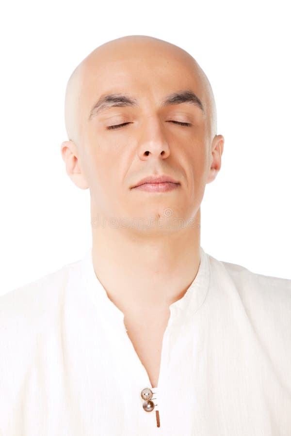 Portait of a bald male meditating isolated, eyes closed. Portait of a bald male meditating isolated, eyes closed