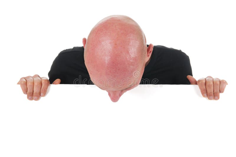 Portrait bald man with white board isolated in studio. Portrait bald man with white board isolated in studio