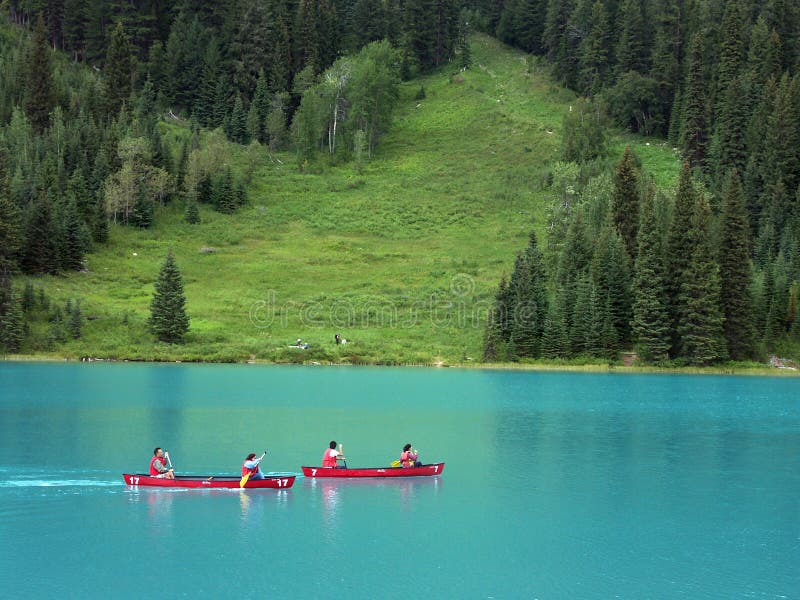 Two canoes on the Emerald lake, showing the unusual colouring of this glacial lake. Two canoes on the Emerald lake, showing the unusual colouring of this glacial lake.