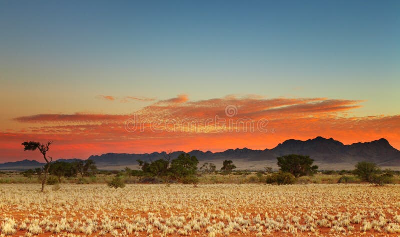 Colorful sunset in Kalahari Desert, Namibia