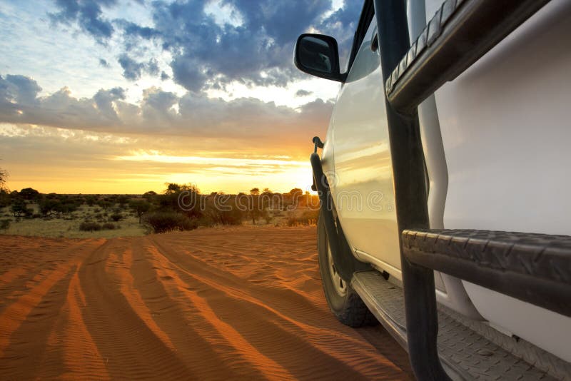 Kalahari sundown with safari suv. Kalahari sundown with safari suv