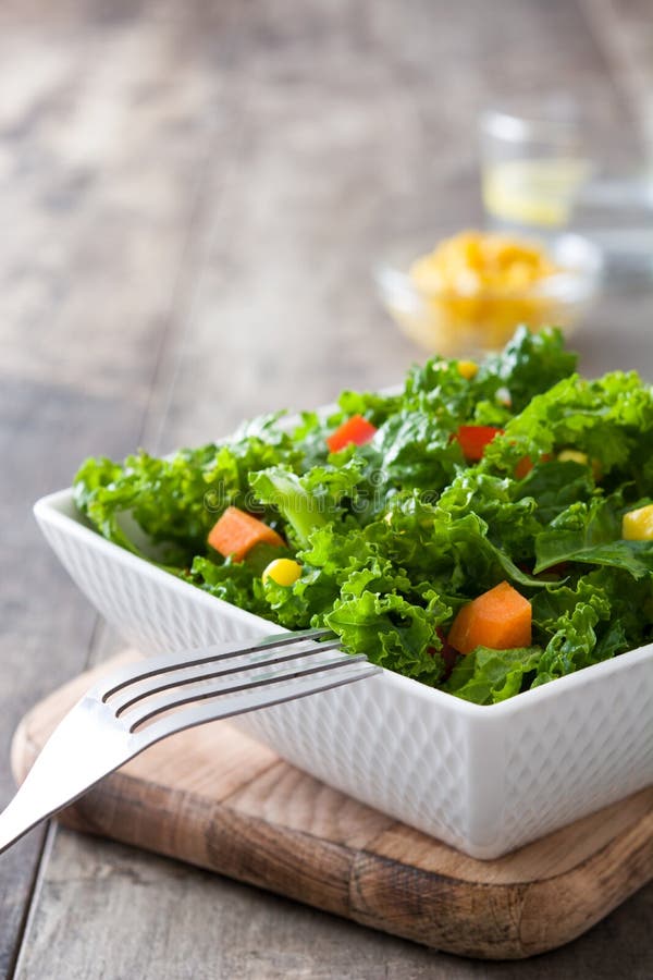 Kale Salad In Bowl With Carrot, Pepper And Sweet Corn Stock Photo