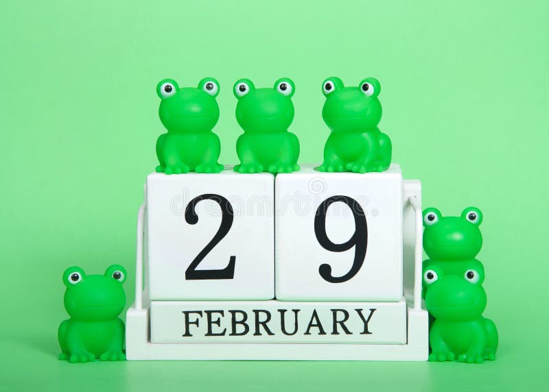 Kalender voor houten blokken 29 februari met kikkers, Leap Year, op groen
