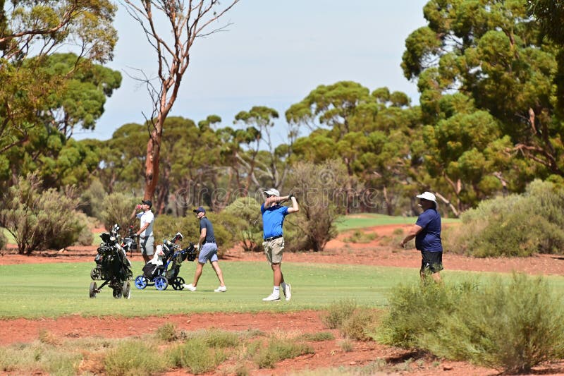 Australian people playing golf in Kalgoorlie Golf Course, designed by Graham Marsh who was one of the best Australian players, rated one of the top courses in Australia. Australian people playing golf in Kalgoorlie Golf Course, designed by Graham Marsh who was one of the best Australian players, rated one of the top courses in Australia