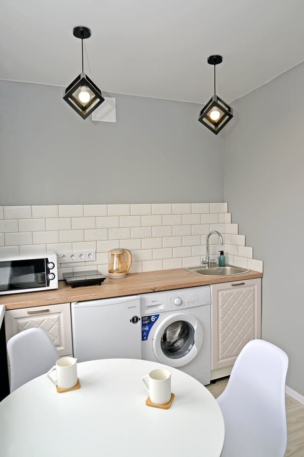 Fragment of modern kitchen interior in light colors stock image