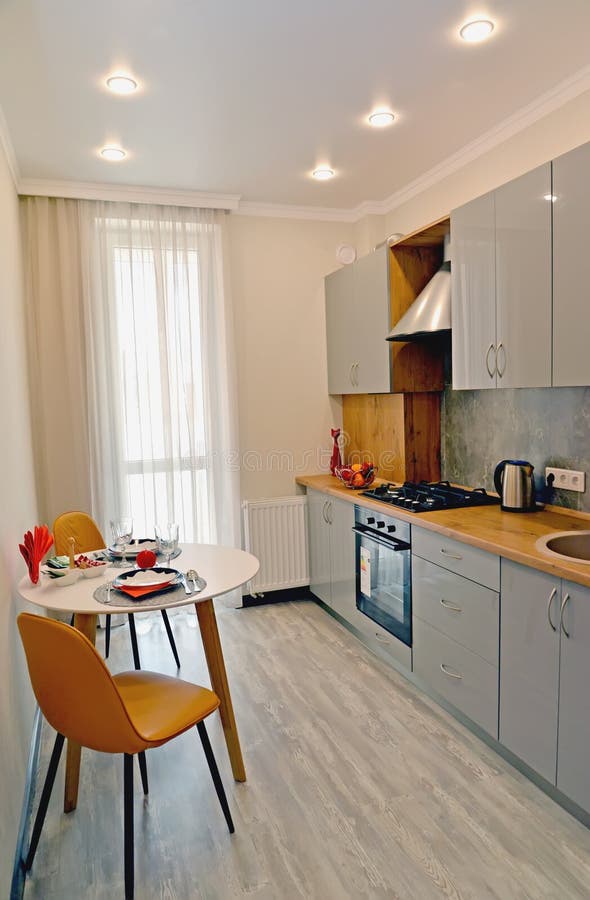Dining Table for Two in the Interior of a Modern Kitchen Stock Photo