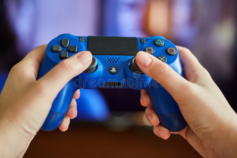 KALININGRAD, RUSSIA - JULY 26, 2019: Young girl holds a remote control from a game console. A girl plays video games. stock images KALININGRAD, RUSSIA - JULY 26, 2019: Young girl holds a remote control from a game console. A girl plays video games. stock images
