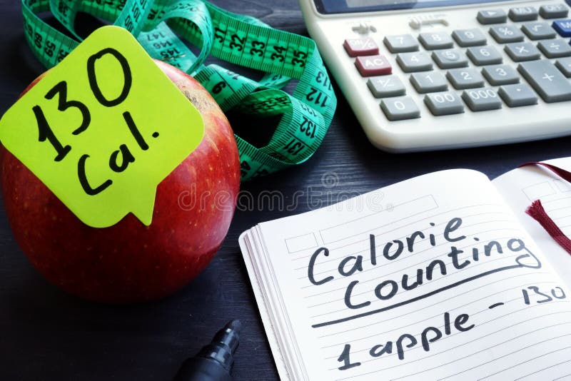Kalorienzählung Apple und unter Kalorien lizenzfreies stockbild Kalorienzählung Apple und unter Kalorien lizenzfreies stockbild