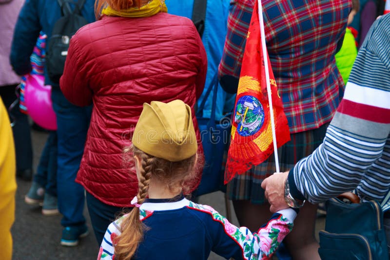 Kaluga city, Russia - May 2019: little girl wearing forage-cap with red USSR flag participates in memorial parade. stock photos Kaluga city, Russia - May 2019: little girl wearing forage-cap with red USSR flag participates in memorial parade. stock photos