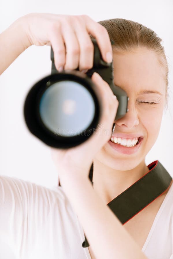 Girl with mirror camera on grey background. Girl with mirror camera on grey background.