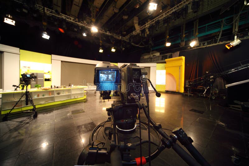 Professional black video camera in television studio, light scene. Professional black video camera in television studio, light scene