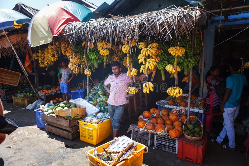 Sellers in street shop sell fresh fruits bananas, papaya and vegetables. Traditional Asian local market royalty free stock photos Sellers in street shop sell fresh fruits bananas, papaya and vegetables. Traditional Asian local market royalty free stock photos