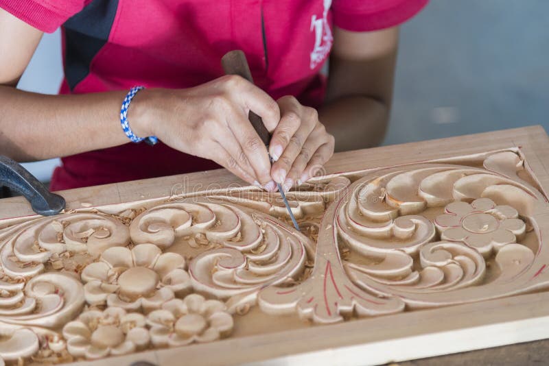 Kandy, Sri Lanka: 03/18/2019: Skilled wood carver hand crafting carvings for the tourist souvenirs