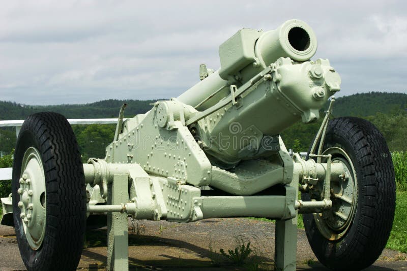 Under a cloudy day a cannon is displayed. Under a cloudy day a cannon is displayed.