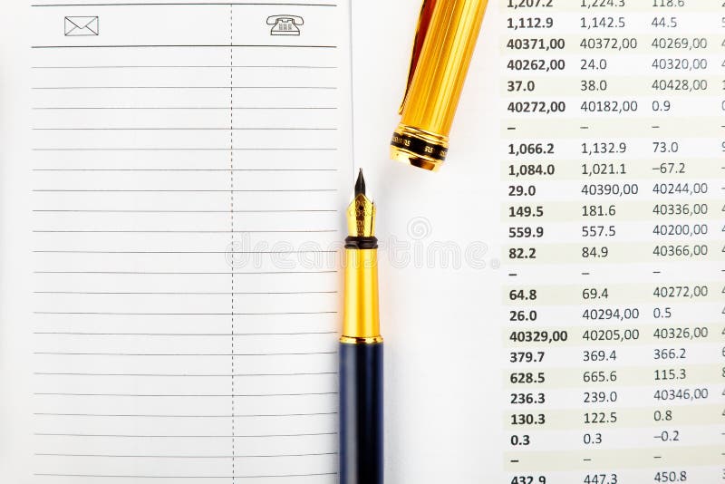 Diary, ink pen and financial documents on office desk. Diary, ink pen and financial documents on office desk