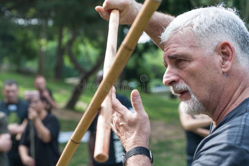 Escrima and kapap instructor demonstrates sticks fighting